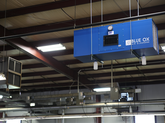 Blue OX 3000 Industrial air cleaner in industrial workplace.