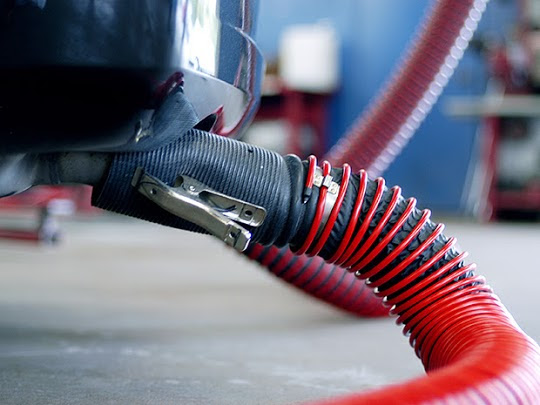 Vehicle exhaust removal system connected to dual exhaust vehicle