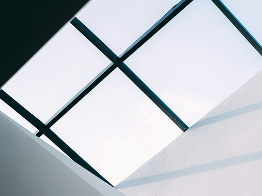 A sky ceiling in a commercial building to represent why workplace air quality matters.